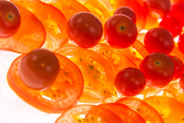 backlit sliced red tomatoes