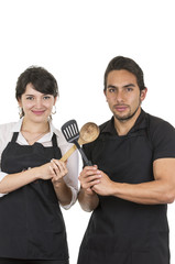 young attractive couple chefs wearing black apron
