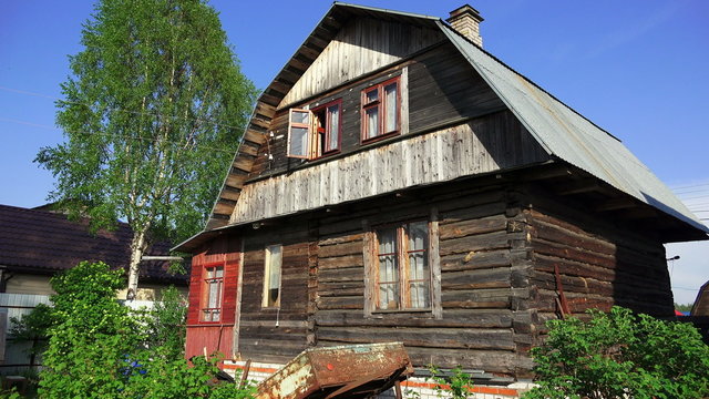 Wooden house in the village. 4K.