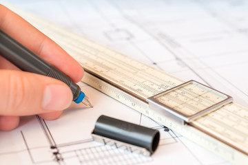 Drawings with pen for draw hold hand and a slide rule. Angle vie