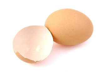 Egg and broken egg on white background.