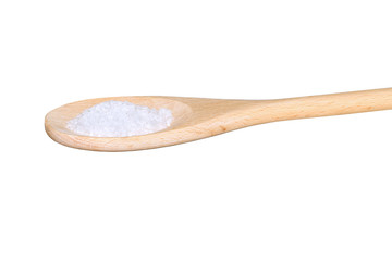 Sea salt on a light colored wooden spoon