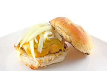 Cheeseburger Topped With Onions On A Toasted Hard Roll