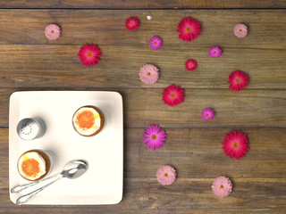 Fresh eggs on wood background.
