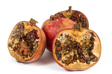 Rotten pomegranate on a white background