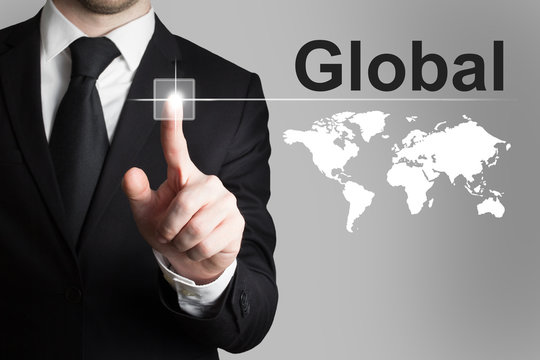 businessman pushing button global worldmap