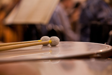 Drumsticks lying on the timpani