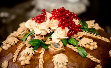 photo of traditional wedding bread decorated with berries
