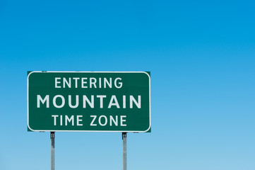 Road sign with Mountain time zone, New Mexico