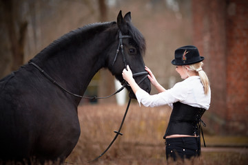 Obraz premium Girl and horse