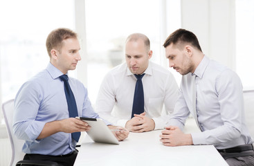 business team working with tablet pc in office