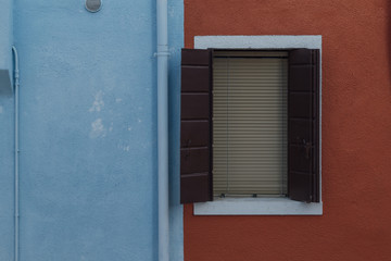 Detail of a Window on a Colorful Wall in Venice
