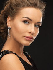 woman with diamond earrings