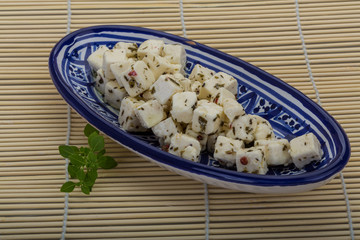 Cheese with spices and oil