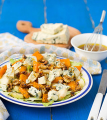 salad with pear, pumpkin, nuts and blue cheese