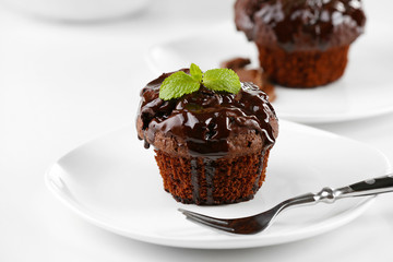 Yummy chocolate cupcake on table, close-up