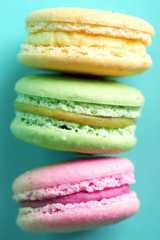 Gentle colorful macaroons on color background