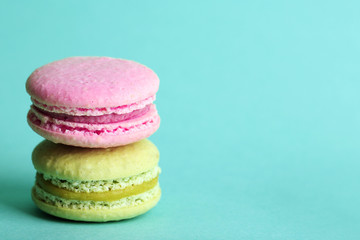Gentle colorful macaroons on color background