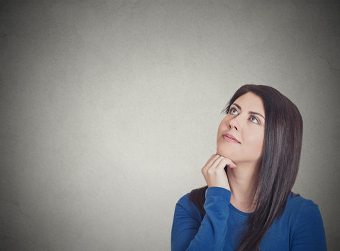 happy beautiful woman thinking looking up planning future 