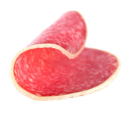 Slice of salami isolated on white background