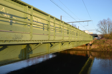 green steel bridge over river