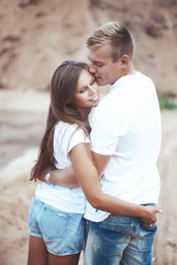 Fototapeta premium Couple holding hands in each other pocket