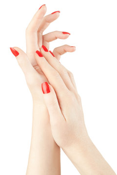Hands with red nail manicure on white, clipping path