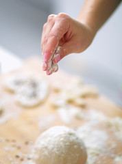 Woman kneading dough, close-up