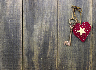 Skeleton key and star hanging on wooden door
