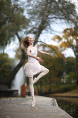 Ballerina whirling on the toe in the park