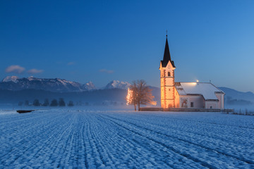 St. Florian church with a view to the alps at dawn - obrazy, fototapety, plakaty