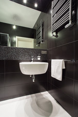 Modern black tiled bathroom