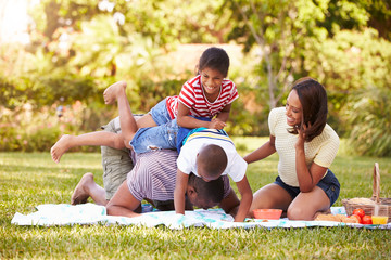 Family Having Fun In Garden Together