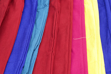 A lot of colorful trousers