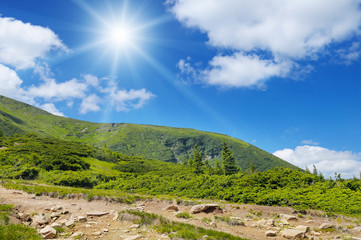 scenic mountains, blue sky and sun