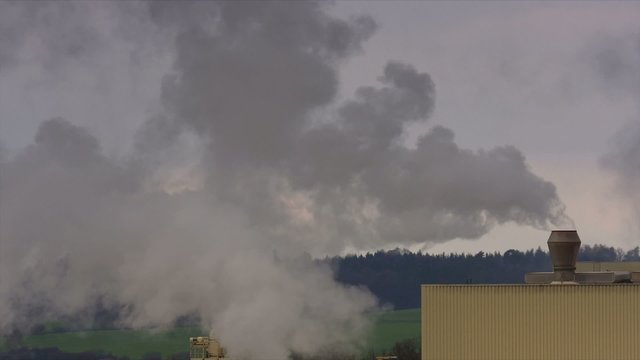 Chemical factory with smoke stack, air pollution