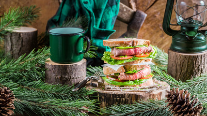 Homemade beef sandwich and coffee for breakfast woodcutter