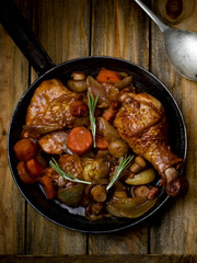 chicken with mushrooms and vegetables, stewed in wine.