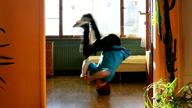 Young breakdancer in the room