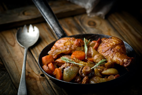 chicken with mushrooms and vegetables, stewed in wine.