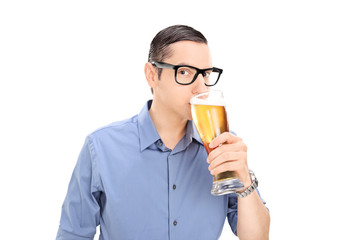 Young guy drinking a pint of beer