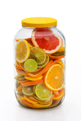 Fototapeta na wymiar Sliced citrus fruits in a jar.