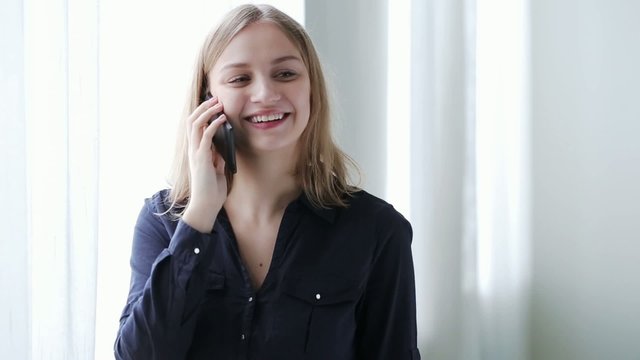 Portrait of woman talking on phone