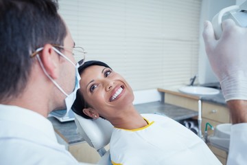 Fototapeta premium Smiling woman waiting for dental exam