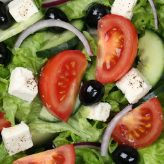 Hintergrund Griechischer Salat mit Tomaten, Feta und Oliven