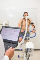 Man doing fitness test on exercise bike