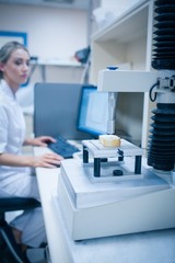Food scientist using technology to analyse bread