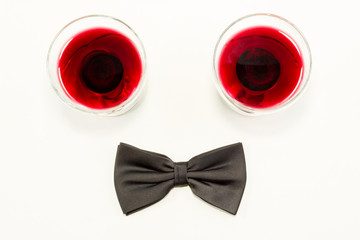 Black bow tie and red wine