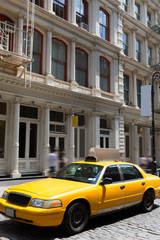 Fototapeta na wymiar New York Soho buildings yellow cab taxi NYC USA