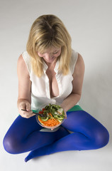 Woman eating helathy food a salad take away meal
